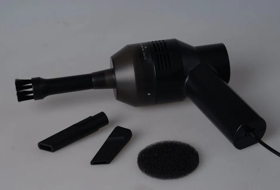 Black handheld mini vacuum cleaner for desktop and keyboard cleaning