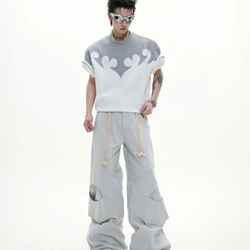 Men's cotton short-sleeved shirt with burnt flower detailing and stitching on a grey background