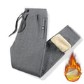 Men's grey fleece-lined cotton track pants with straight legs, showcasing mid-waist design and micro-elastic fabric for plus-size fit.