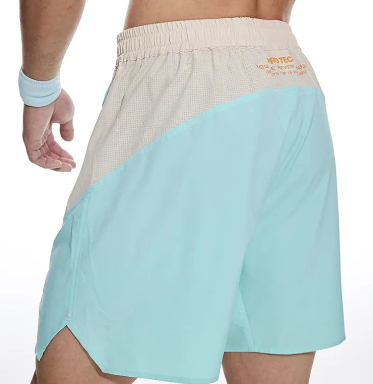 Men's loose fit workout shorts with elastic lace-up waist in Dark Rock Ash colour, shown during weightlifting exercise