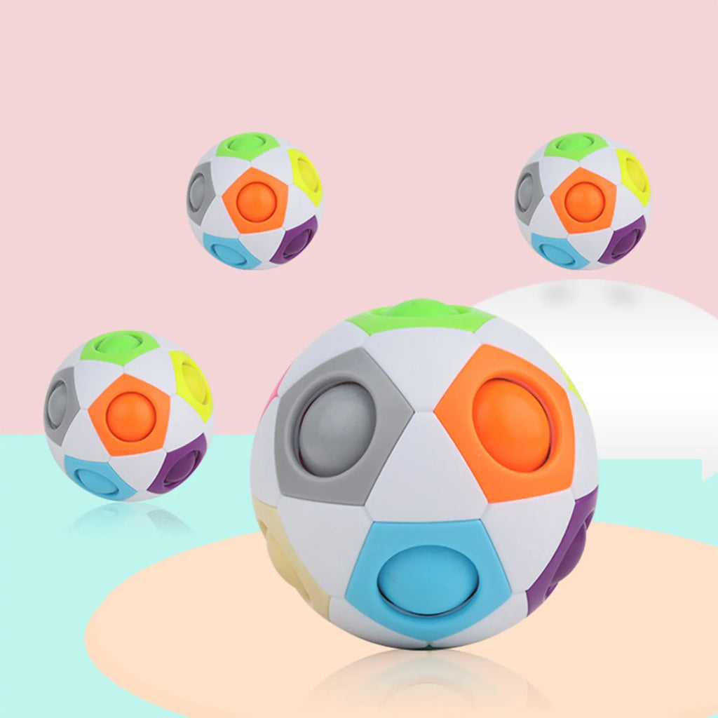 Rainbow coloured plastic ball puzzle with hexagon pattern, 5.5 cm in diameter.