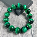 Green tiger eye stone bracelet with geometric beads in hand-polished finish showing natural colour banding