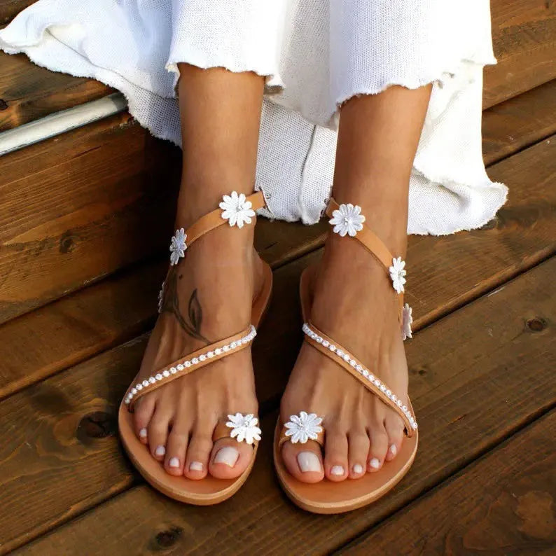 Brown ladies casual beach Roman sandals with herringbone toe and floral pattern on artificial PU upper