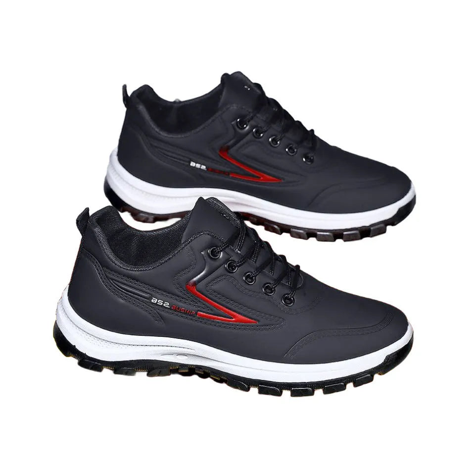 Waterproof casual sports shoes in black-grey colour with flat plastic sole and low-top design