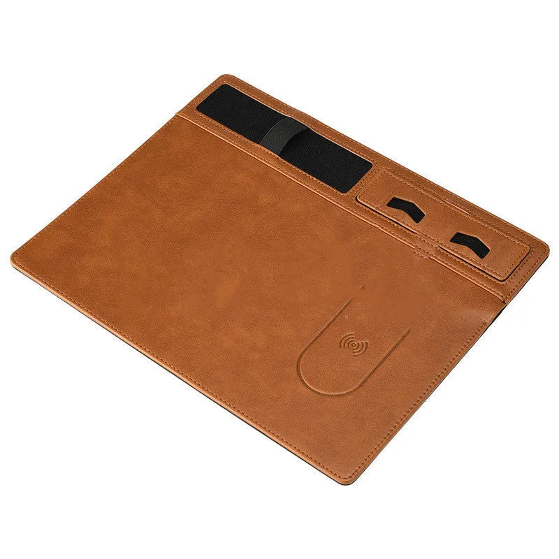 Multifunctional wireless charging mouse pad with phone holder on desk, showing 320x260mm PU surface in black colour