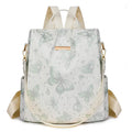 Butterfly printed black PU leather backpack with visible sewing lines and a physiological curve backplate.