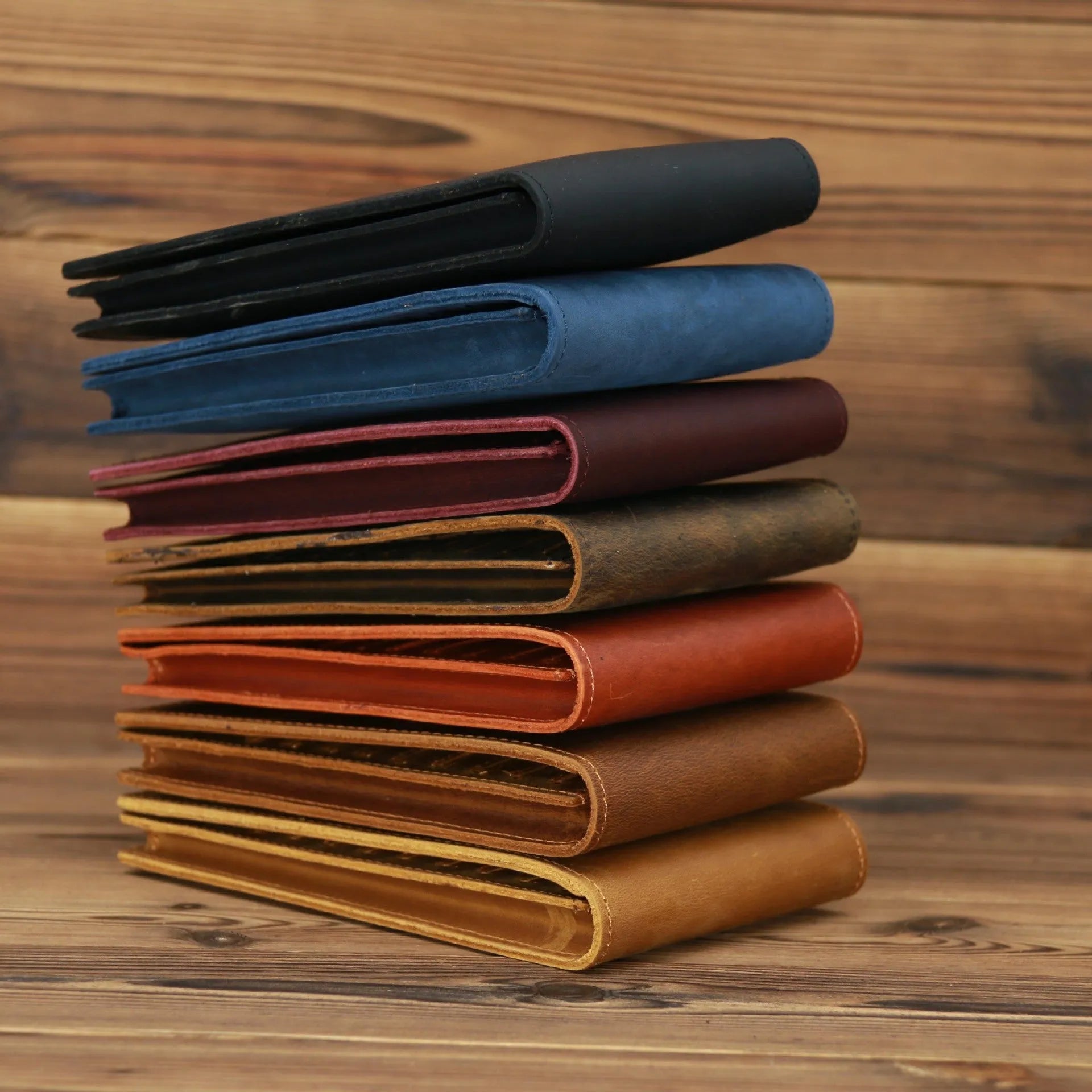 Men's long cowhide leather wallet showing card slots, money pocket, and mobile phone compartment.