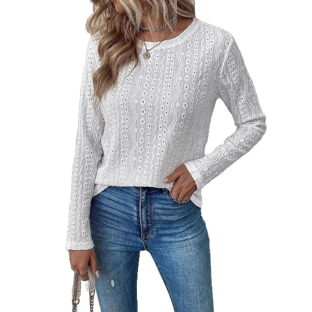 White loose fit long sleeve round neck t-shirt on a hanger