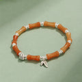 Green Aventurine bamboo crystal bracelet with multiple gemstones including strawberry quartz and olive jade