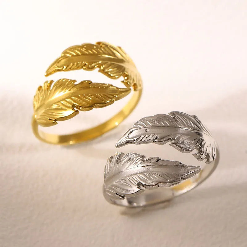 Women's adjustable opening feather fashion ring in silver or gold colour on titanium steel.