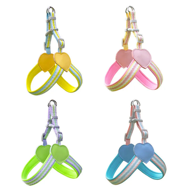 A pink nylon dog chest strap harness connected to a 1.5 metre long matching rope lead on a neutral background.