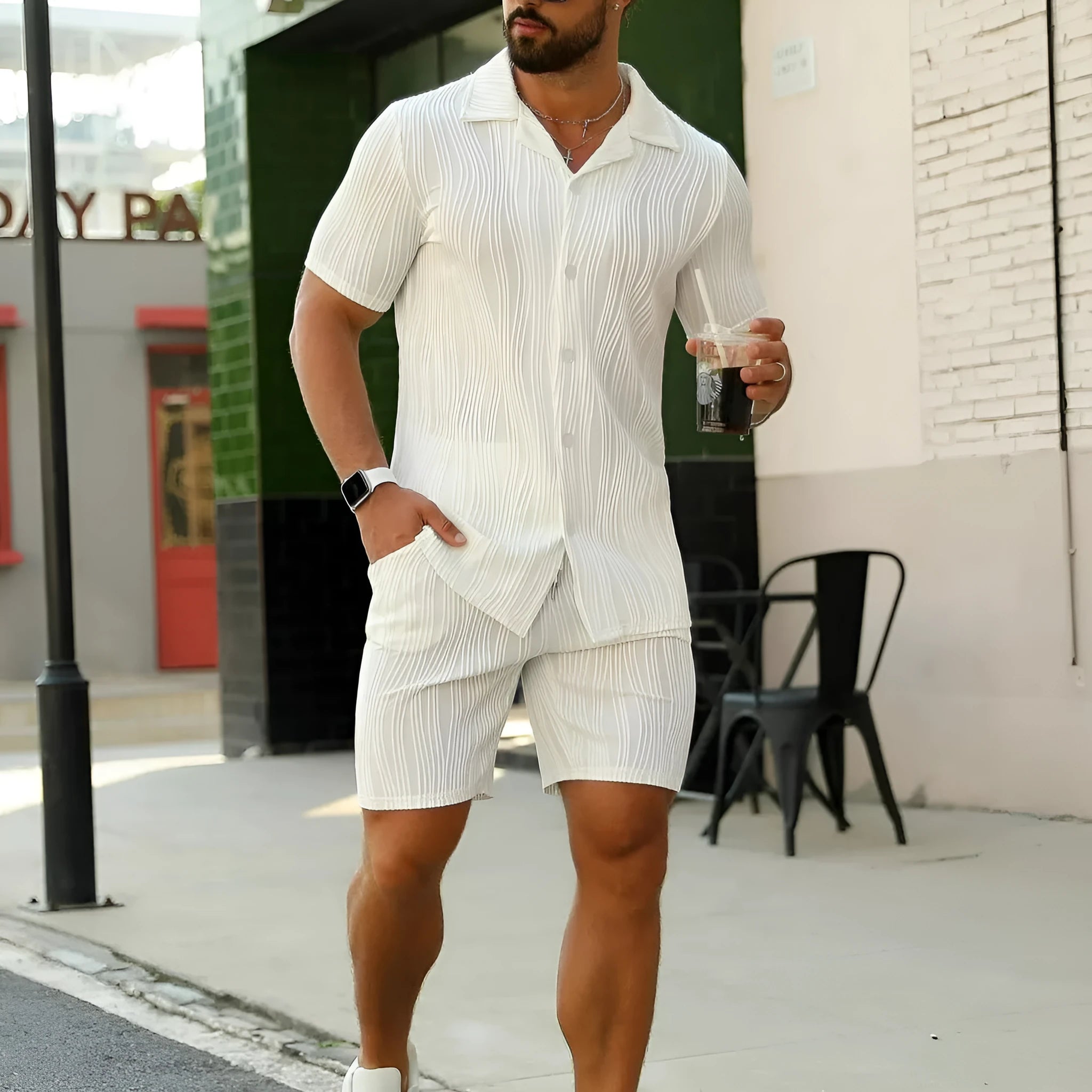 Men's black wave pattern short sleeve shorts suit laid flat showing shirt and matching shorts