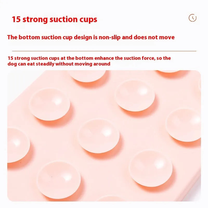 Grey silicone pet licking mat with textured surface and a white suction cup on the back.