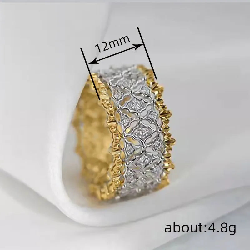 Geometric two-tone zircon ring on finger showing copper construction with electroplated finish and round stone