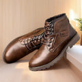 Men's brown ankle boot with a side zip and round toe on a rubber sole