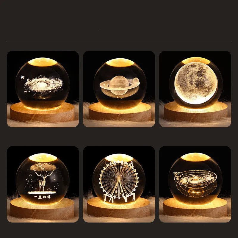 3D crystal ball night light projecting starry sky and planets from its 6cm sphere on a solid wood base.