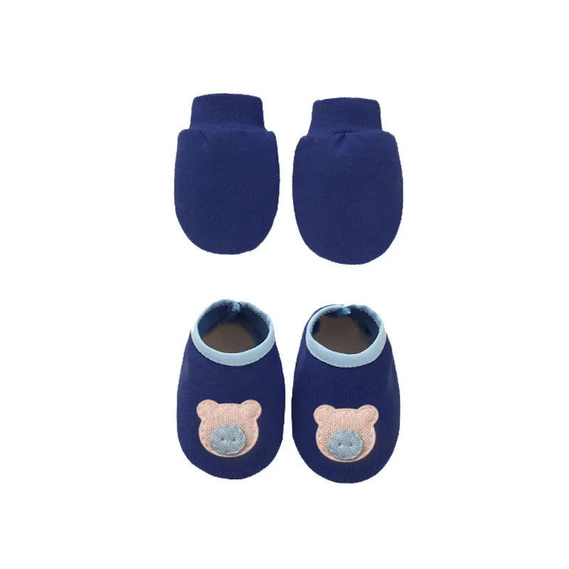 Baby cotton gloves, foot covers, and cap set shown in multiple colour options including pink, blue, grey, and white.