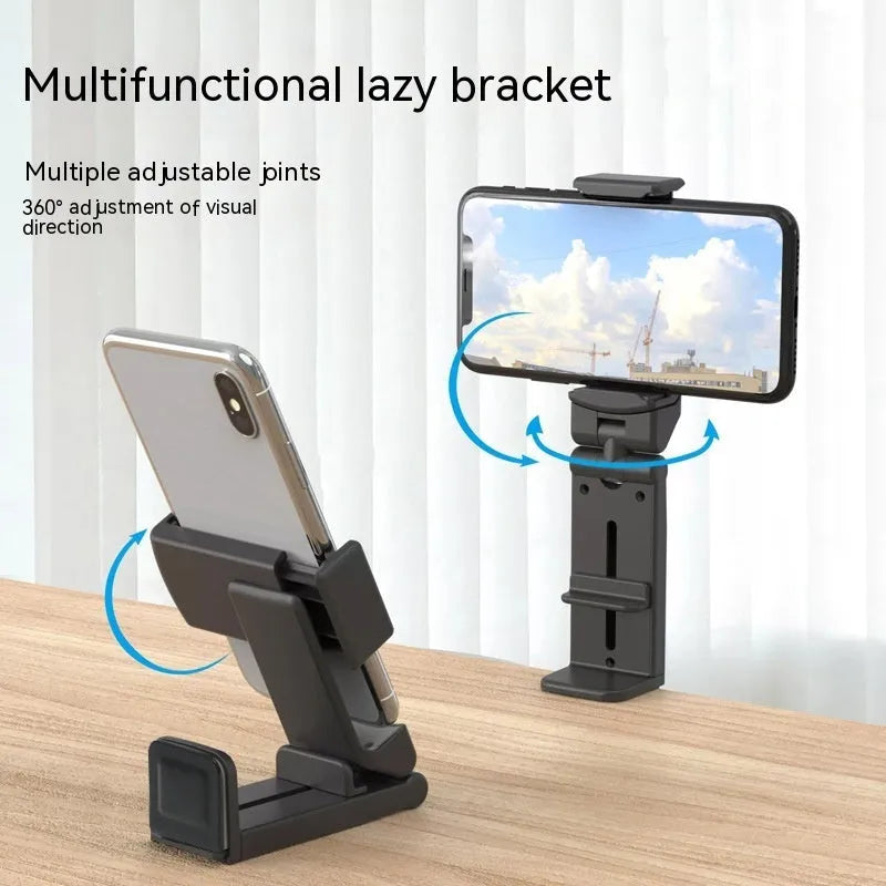 Black 360-degree rotating collapsible phone holder on desktop showing adjustable angle