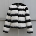 Black and white striped faux fur jacket with long sleeves on female model