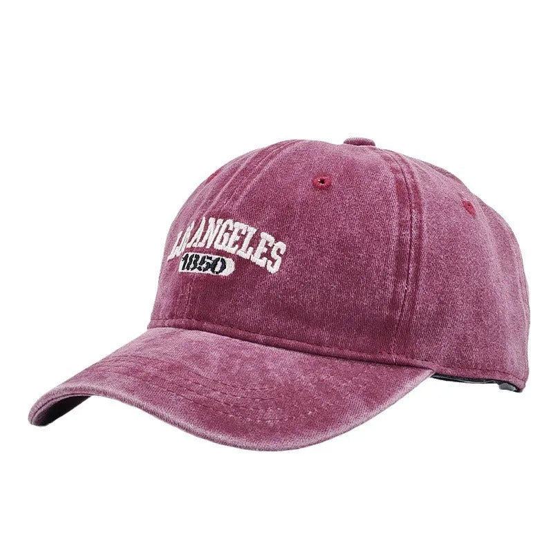 Retro personalised embroidered peaked cap showing adjustable strap and conical crown structure in beige colour