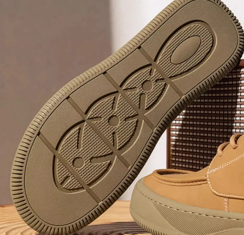 Brown retro leather casual shoes with big toe design and visible stitching on a rubber sole.