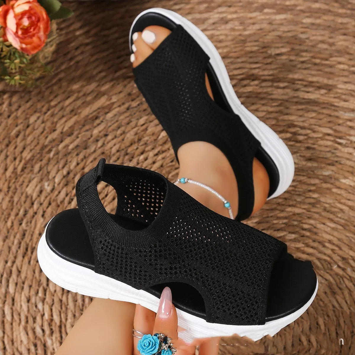 Women's black platform sports sandals with a flat toe bracket and mesh lining on a rubber sole.