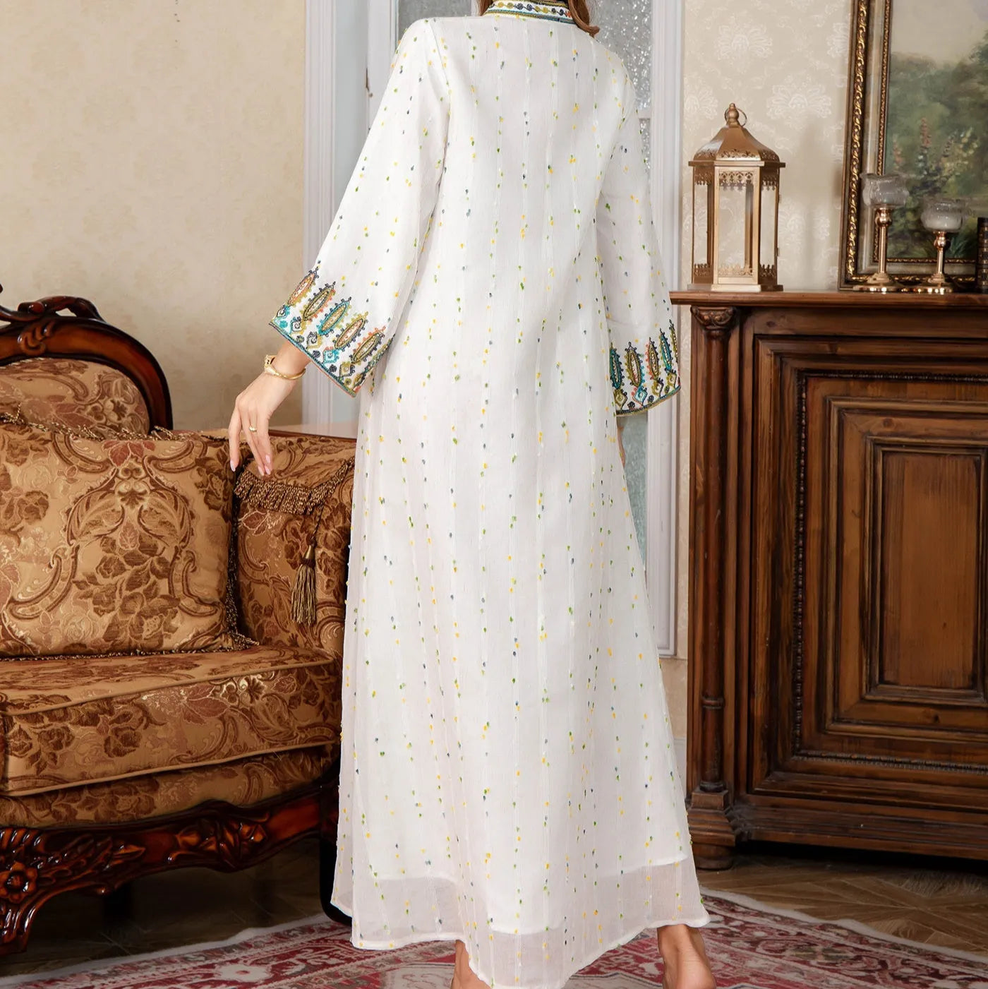 White long sleeve Arabic robe abaya with long skirt on a hanger