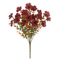Artificial flower bouquet in autumn colours of red, yellow, and orange for home and event decoration.