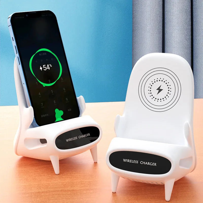 White mini chair shaped wireless charging stand holding smartphone on desk