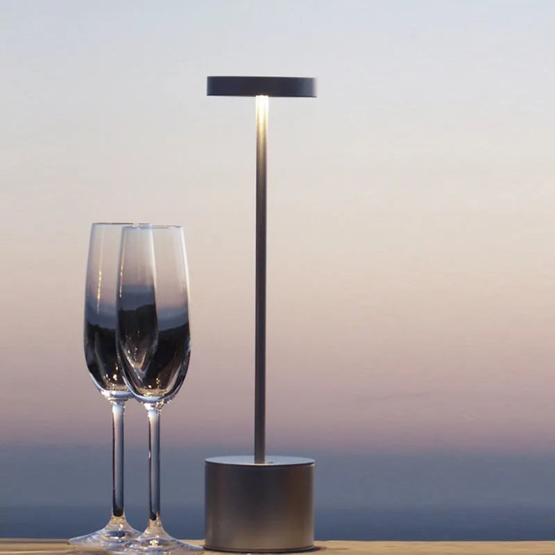 All-aluminium rechargeable LED desk lamp with touch dimming control in silver finish