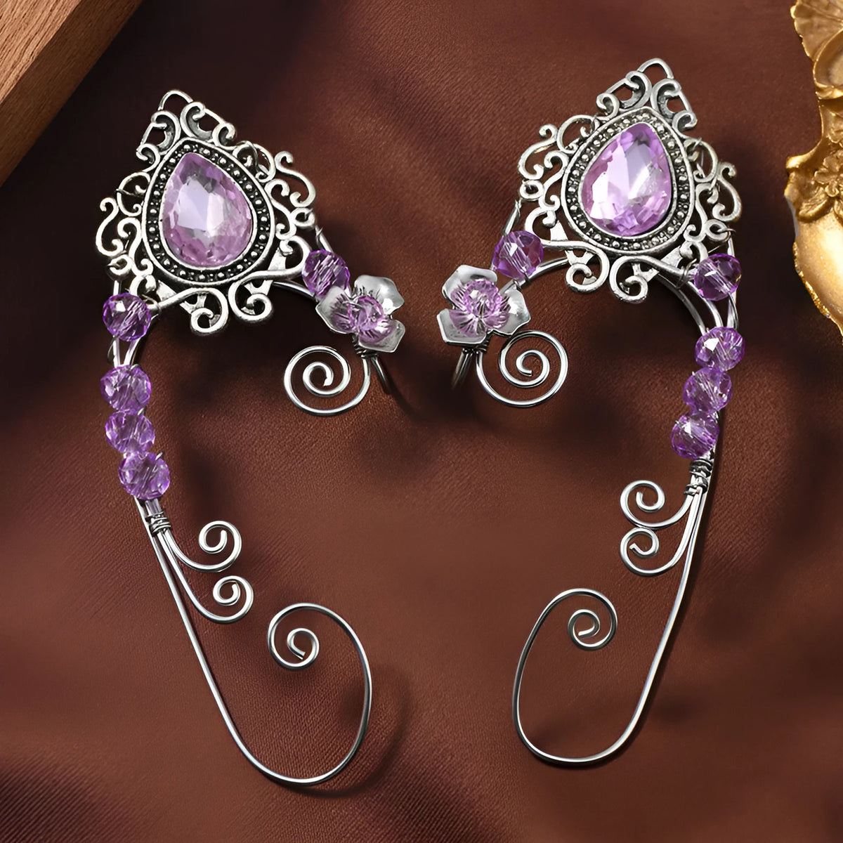 Hand-woven purple crystal clip-on earrings in a right and left pair with mixed material vintage design