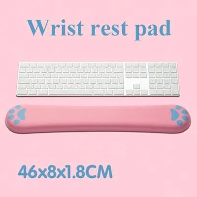 Cat's claw cartoon design memory foam keyboard wrist rest pad in blue, showing its length and thickness on a desk.