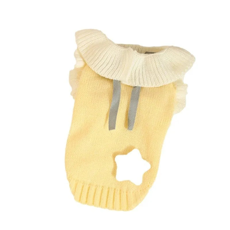 Yellow acrylic dog sweater on a small puppy, showing a casual knitted design.