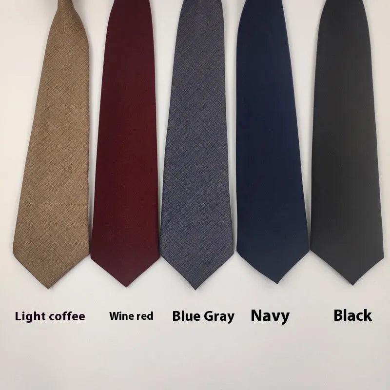 Navy blue solid colour cotton men's tie with arrow style design on a white background.