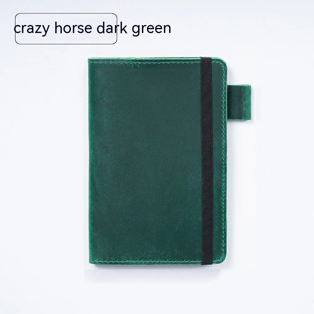 Handmade leather kraft notebook open showing wood-free paper with dark green cowhide cover