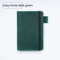 Handmade leather kraft notebook open showing wood-free paper with dark green cowhide cover