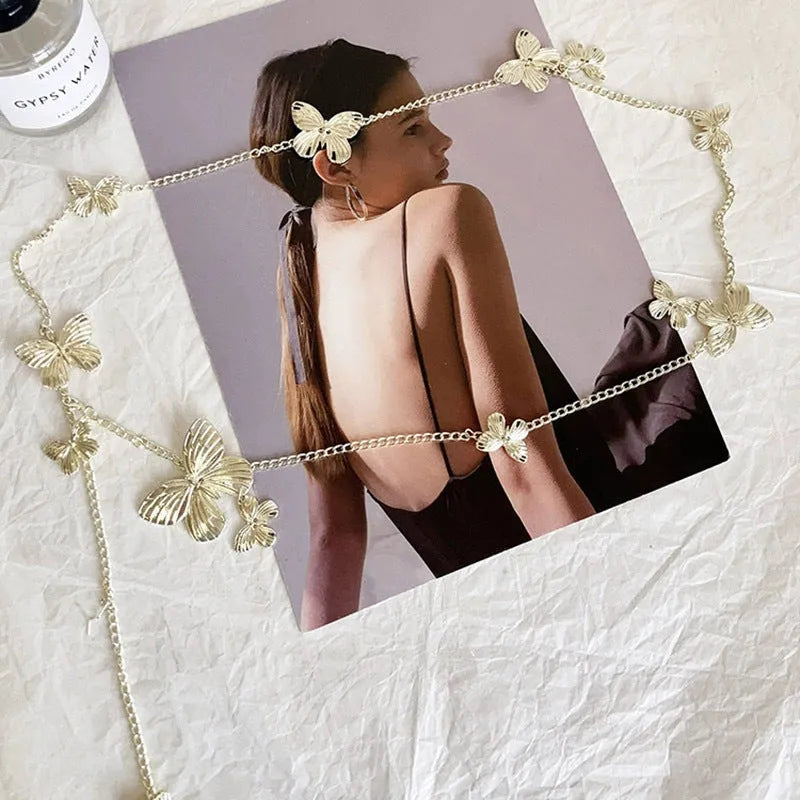 Golden butterfly waist chain with adjustable clasp, 104cm length, on a model showing retro style.