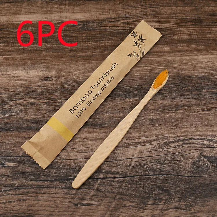Set of 10 bamboo toothbrushes with charcoal bristles in various colours showing 17.5cm handles
