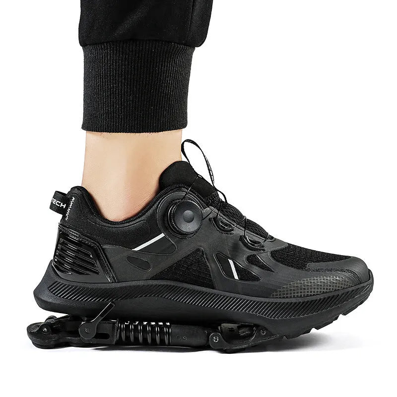 Black tech running shoes with mesh upper, leather stitching, buckle fastening, and a rubber EVA sole.