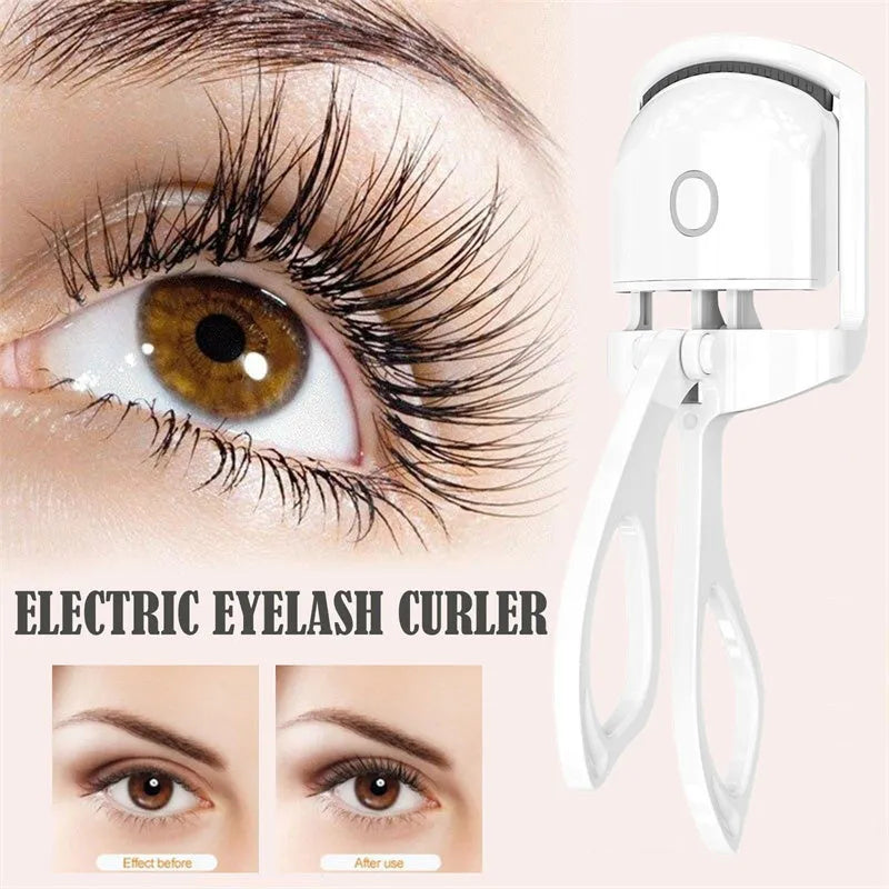 Pink and white USB rechargeable heated eyelash curler with temperature control buttons.