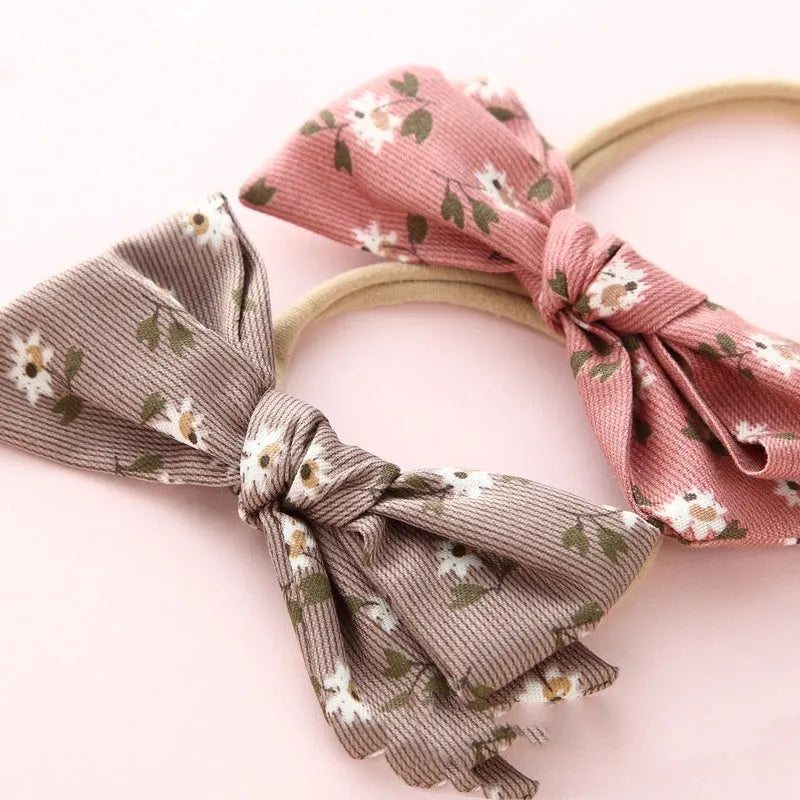 Children's cloth knotted bow hair ring in a Snow White princess print.