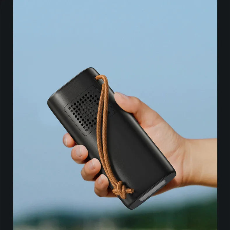 Black portable power bank with solar panel, 70mm width, showing USB ports and power indicator lights