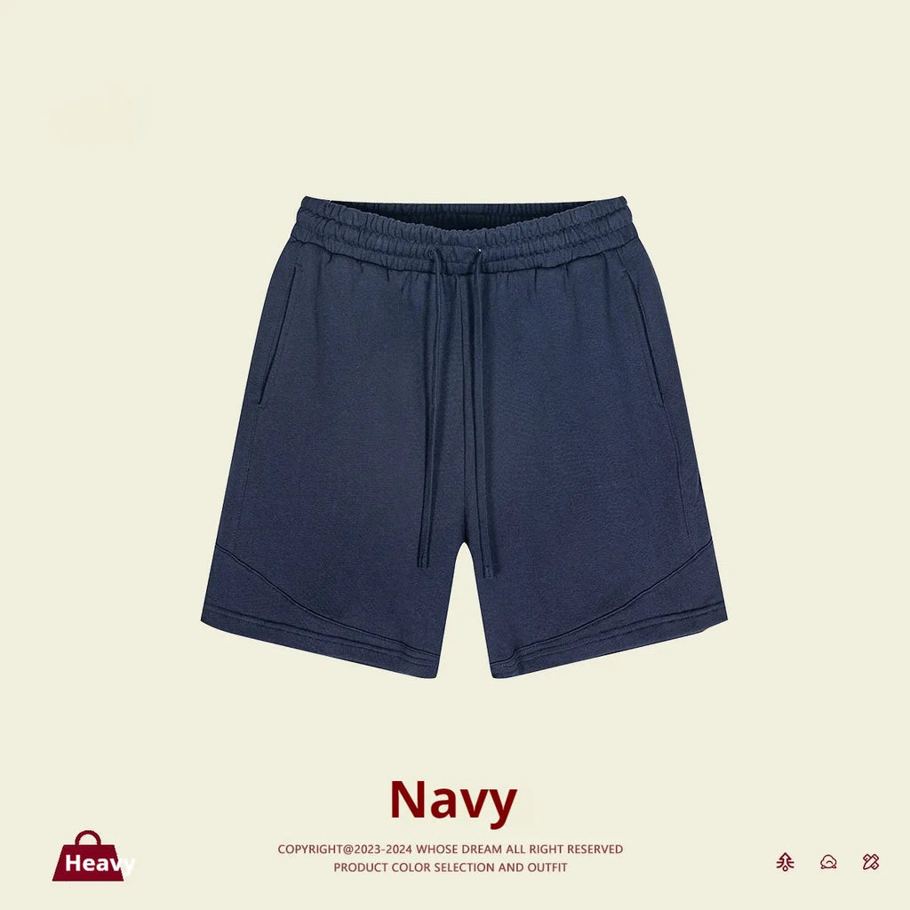 Children's loose fit cotton sports shorts in solid colours on a size chart