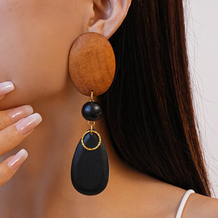 Handcrafted wooden earrings with elliptical design in silver brown black colours