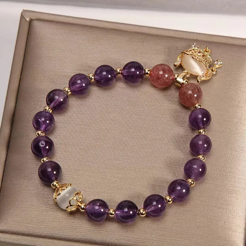 Women's longevity lock bracelet with natural amethyst crystals and gold-plated safety lock charm