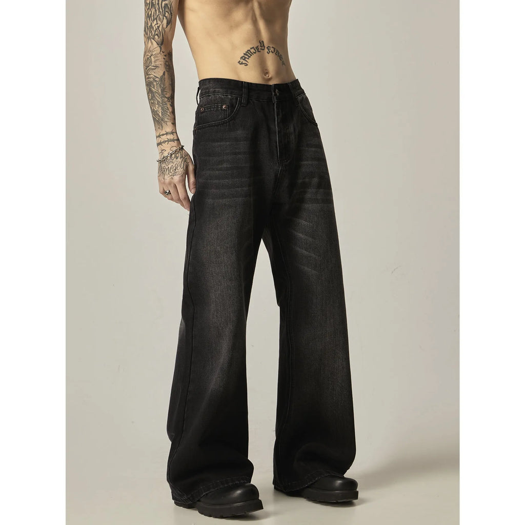 Black loose straight jeans with zipper fly on mannequin showing retro style and structured fit