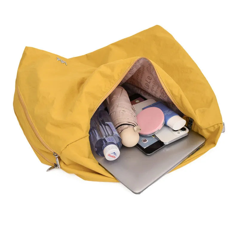 Heart-shaped nylon underarm bag for women in black, blue, khaki, or yellow, showing large capacity and soft design