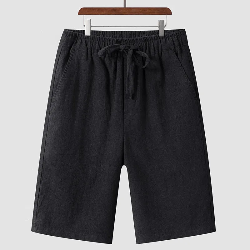 Men's loose linen shorts in beige colour with cropped length and elastic waistband