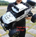 Black or silver remote control climbing car with 2.4G wireless remote on rough terrain