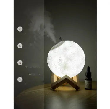 Spherical white lunar humidifier and night light with USB charging port and soft LED glow.